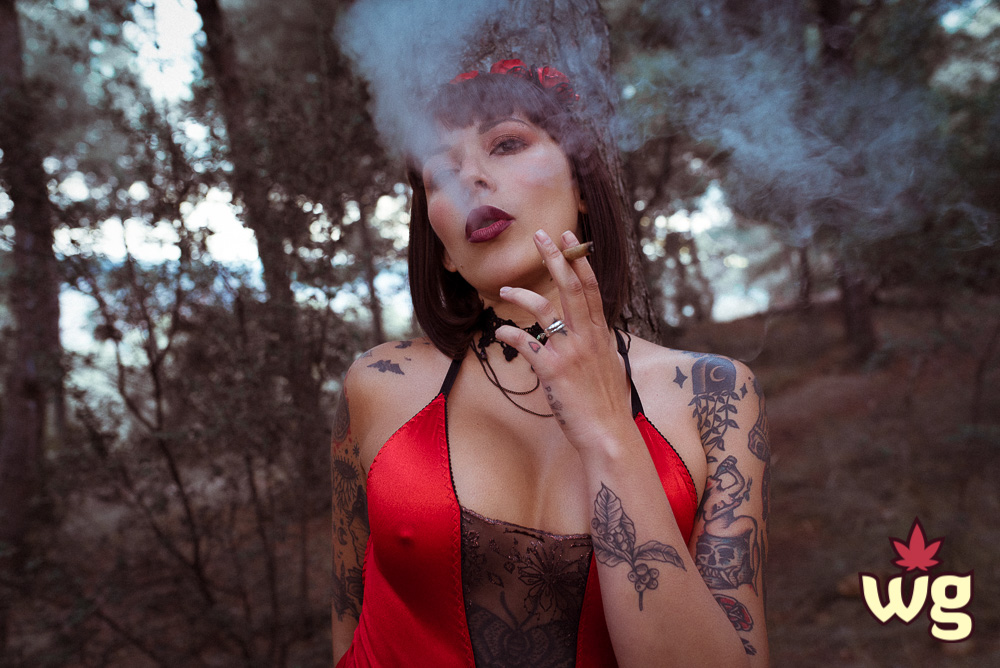 Sexy witch smoking weed in the woods